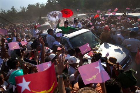 Suu Kyi greets crowds while campaigning in Pathein, Myanmar, in 2012. She was running for a seat in parliament.