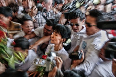 Suu Kyi makes her way through a crowd in 2012, a day after she won a seat in parliament. It was Myanmar's first multiparty elections since 1990.