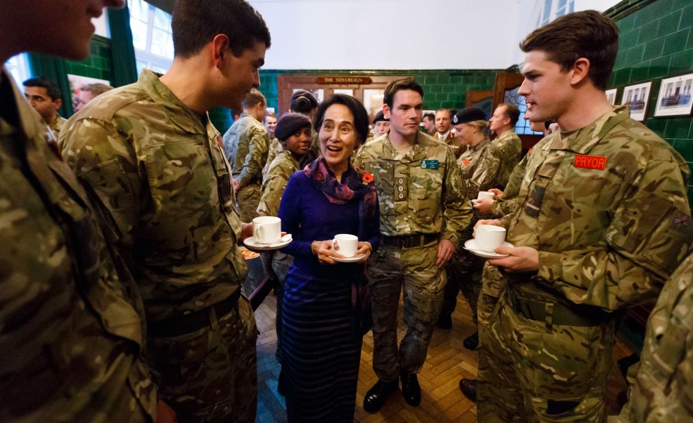 Suu Kyi joins officer cadets for tea while visiting a military academy in Camberley, England, in 2013.