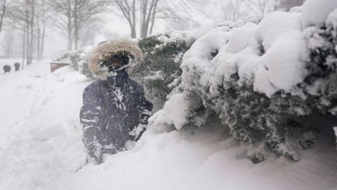 Arturo Diaz, 4, plays in a deep snow bank in Hoboken, New Jersey, on Monday.
