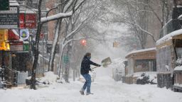 A person shovels snow in the Greenwich Village neighborhood during a snow storm, amid the coronavirus disease (COVID-19) outbreak, in the Manhattan borough of New York City, New York, U.S., February 1, 2021.  REUTERS/Andrew Kelly