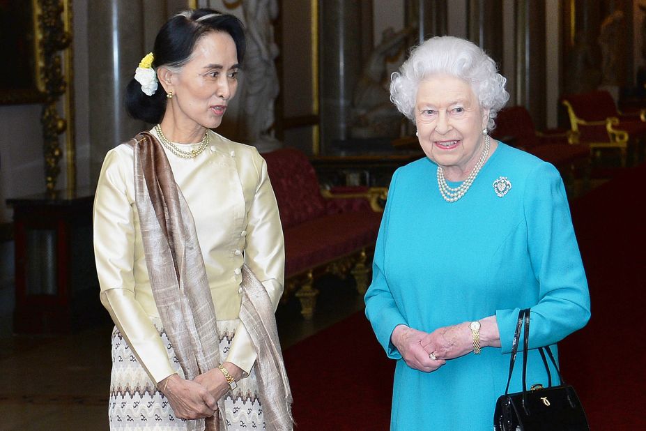 Britain's Queen Elizabeth II greets Suu Kyi ahead of a private lunch at Buckingham Palace in 2017.
