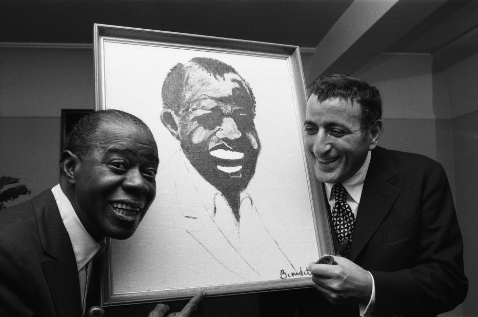 Bennett presents jazz great Louis Armstrong with a portrait that he painted in 1970. Bennett became an accomplished painter with artworks on permanent display at the Smithsonian in Washington, DC.