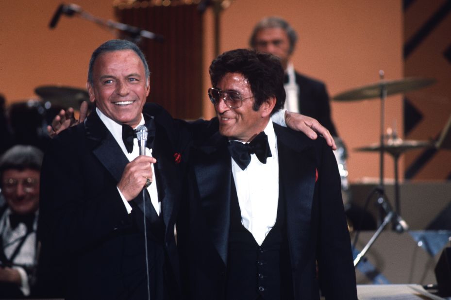 Frank Sinatra puts his arm around Bennett in the TV special "Frank Sinatra and Friends" in 1977.