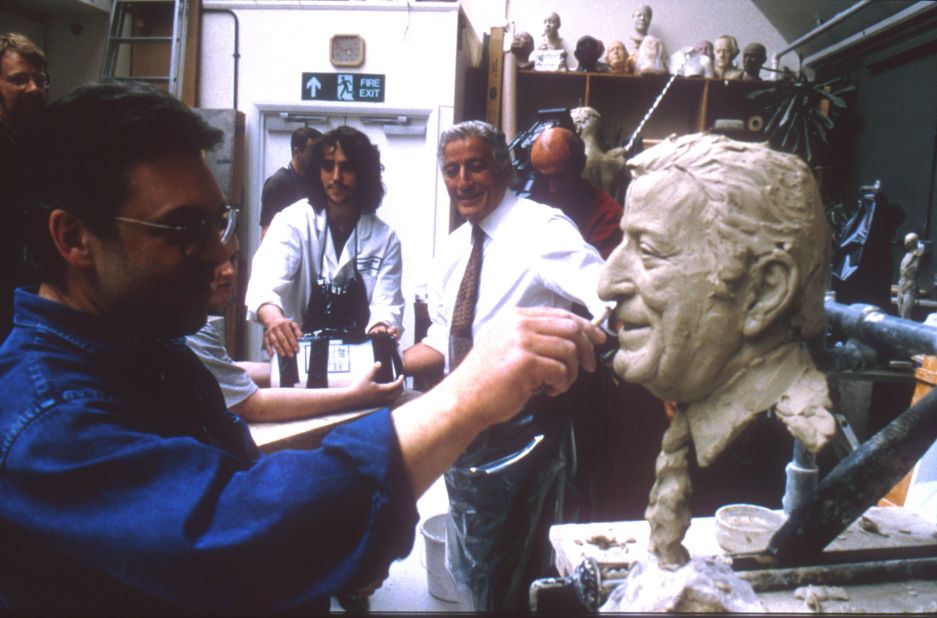 Bennett watches an artist work on a wax figure of him at Madame Tussaud's in New York in 2000.