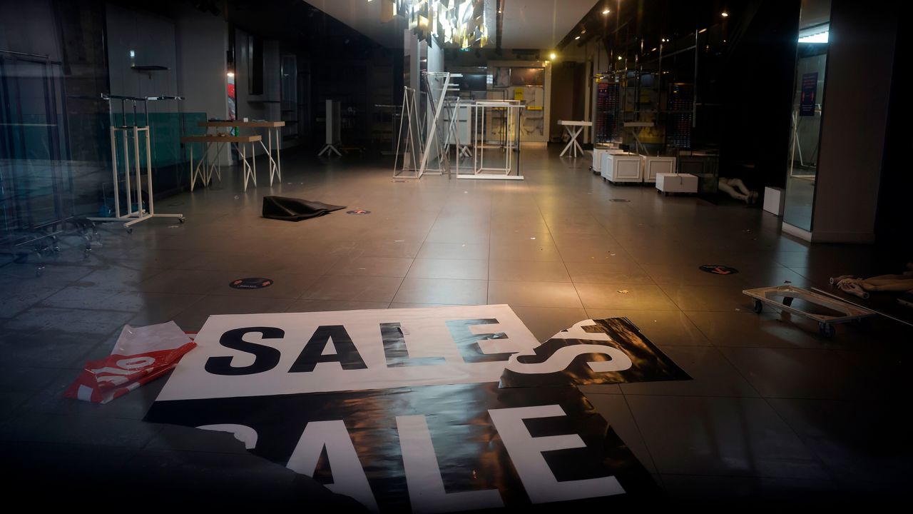 The deserted interior of a closed-down Topshop fashion store in London.