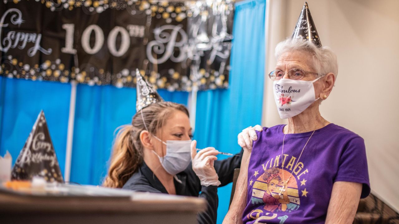 Mildred Grassman gets the vaccine