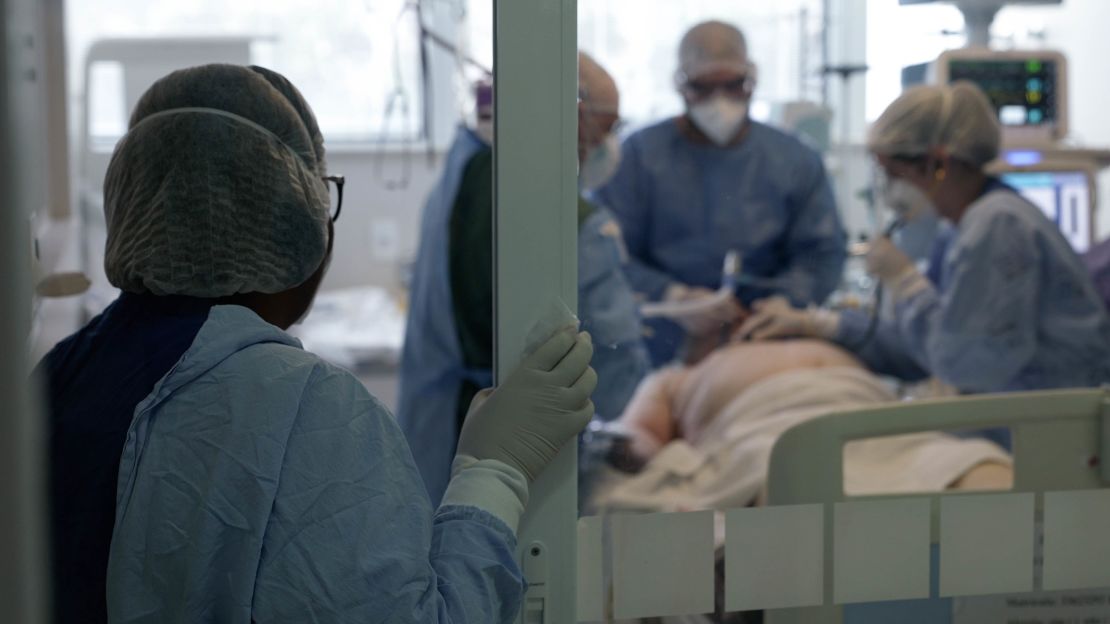 An ICU nurse looks on as a Covid-19 patient is intubated in São Paulo, Brazil.