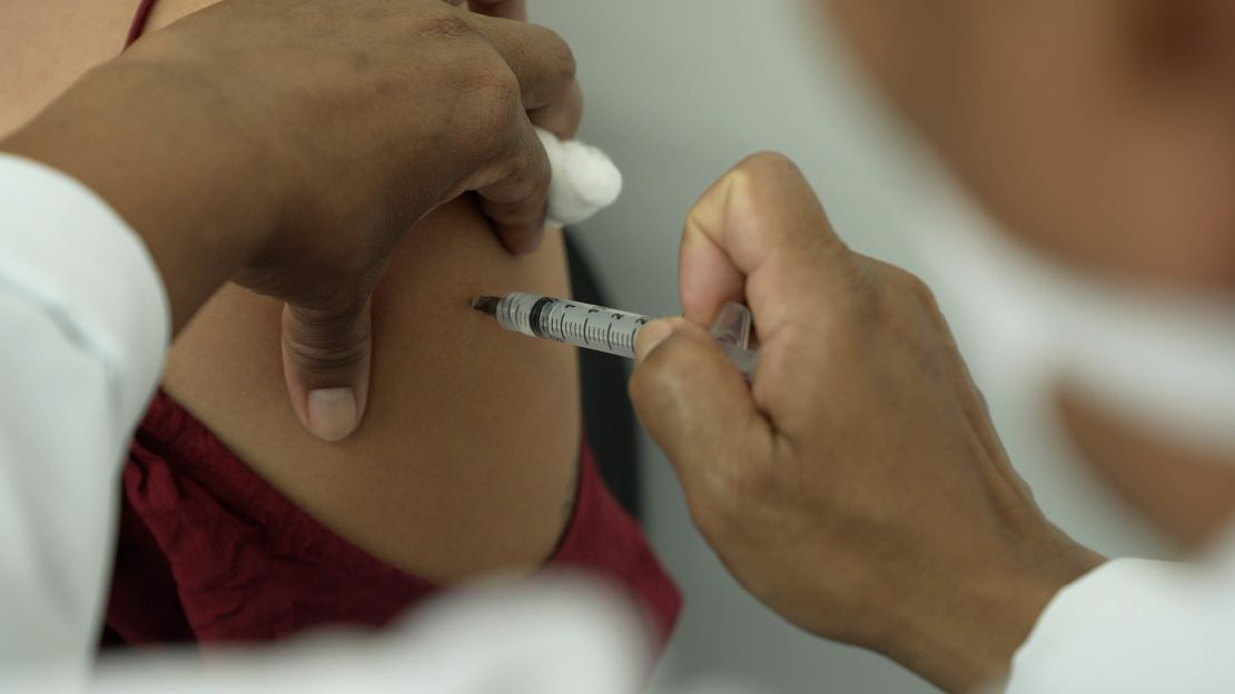 A woman receives the first dose of the AstraZeneca vaccine in S?o Paulo, Brazil.