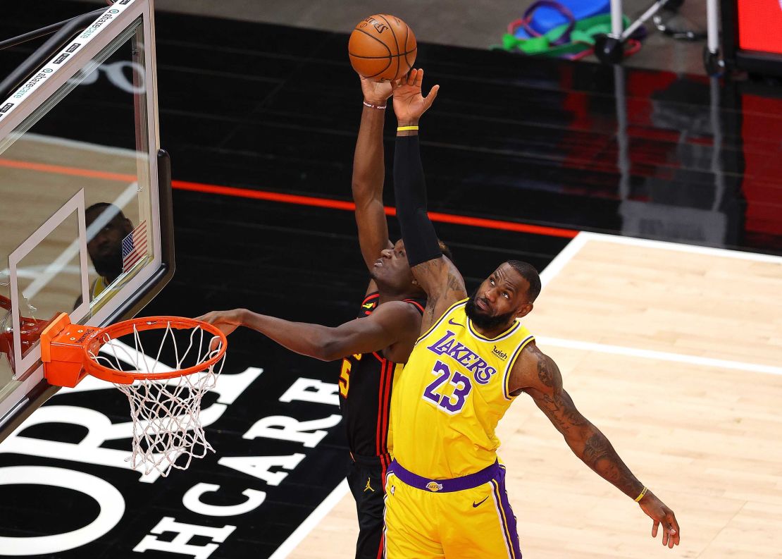 James defends a pass intended for Clint Capela of the Atlanta Hawks.