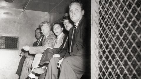 From left, Communist Party USA members Benjamin Davis Jr., Eugene Dennis, Gilbert Green, John Williamson and Gus Hall are transported to a jail cell in October 1949. 