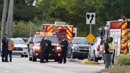 Law enforcement officers block an area where a shooting wounded several FBI while serving an arrest warrant, Tuesday, Feb. 2, 2021, in Sunrise, Florida.