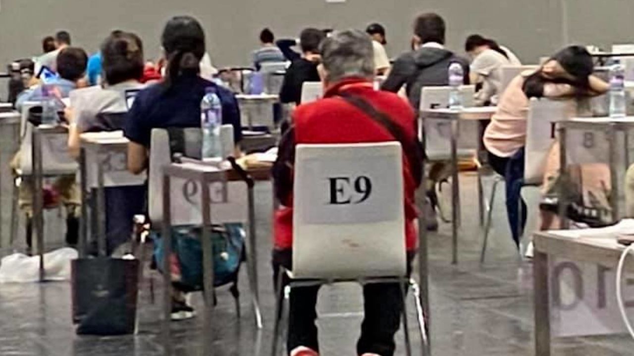 Anna Gong waits for her test results. Sharon Hawkins Leung, who took this photo, joked she had just tried to "make a run for it but the guards made her return to seat!"
