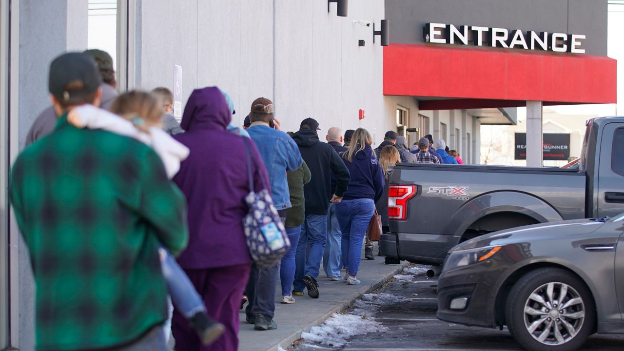 People line up to buy guns and ammunition at the Ready Gunner gun store on January 10, 2021 in Orem, Utah.