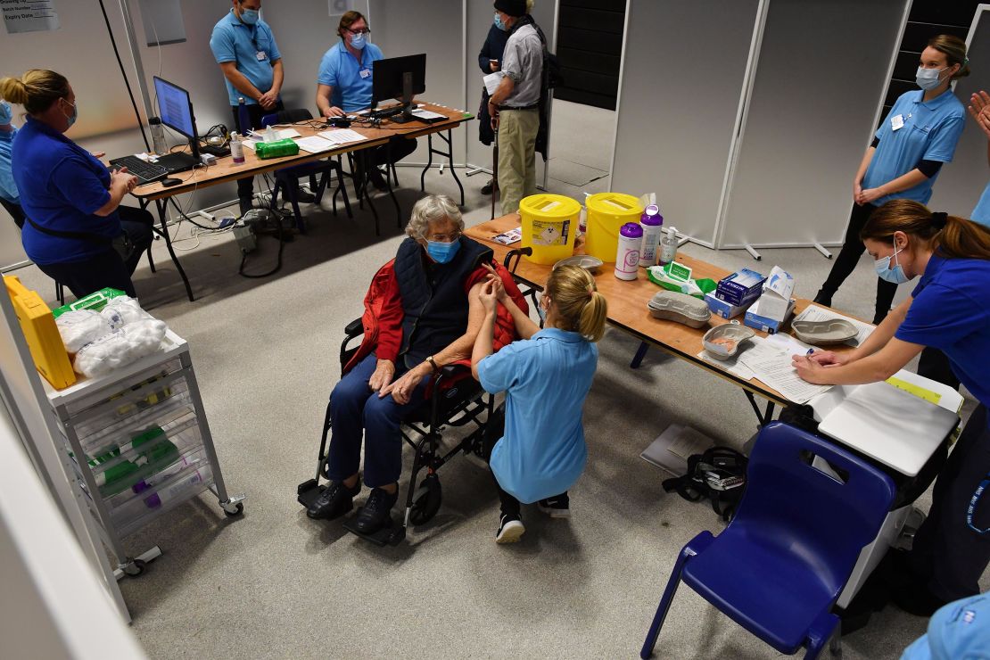 A patient receives an injection of the Oxford/AstraZeneca Covid-19 vaccine at a vaccination center in Brighton, southern England, on January 26, 2021.