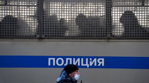 Silhouettes of detained people are seen in a police truck near the Moscow City Court.