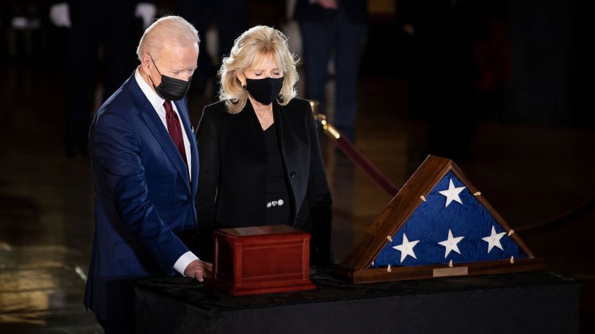 US President Joe Biden and First Lady Jill Biden pay their respects to late US Capitol Police officer Brian Sicknick, as he lies in honor in the Capitol Rotunda in Washington, DC February 2, 2021. - Sicknick died on January 7 from injuries he sustained while protecting the US Capitol during the January 6 attack on the building (Photo by Brendan Smialowski / POOL / AFP) (Photo by BRENDAN SMIALOWSKI/POOL/AFP via Getty Images)