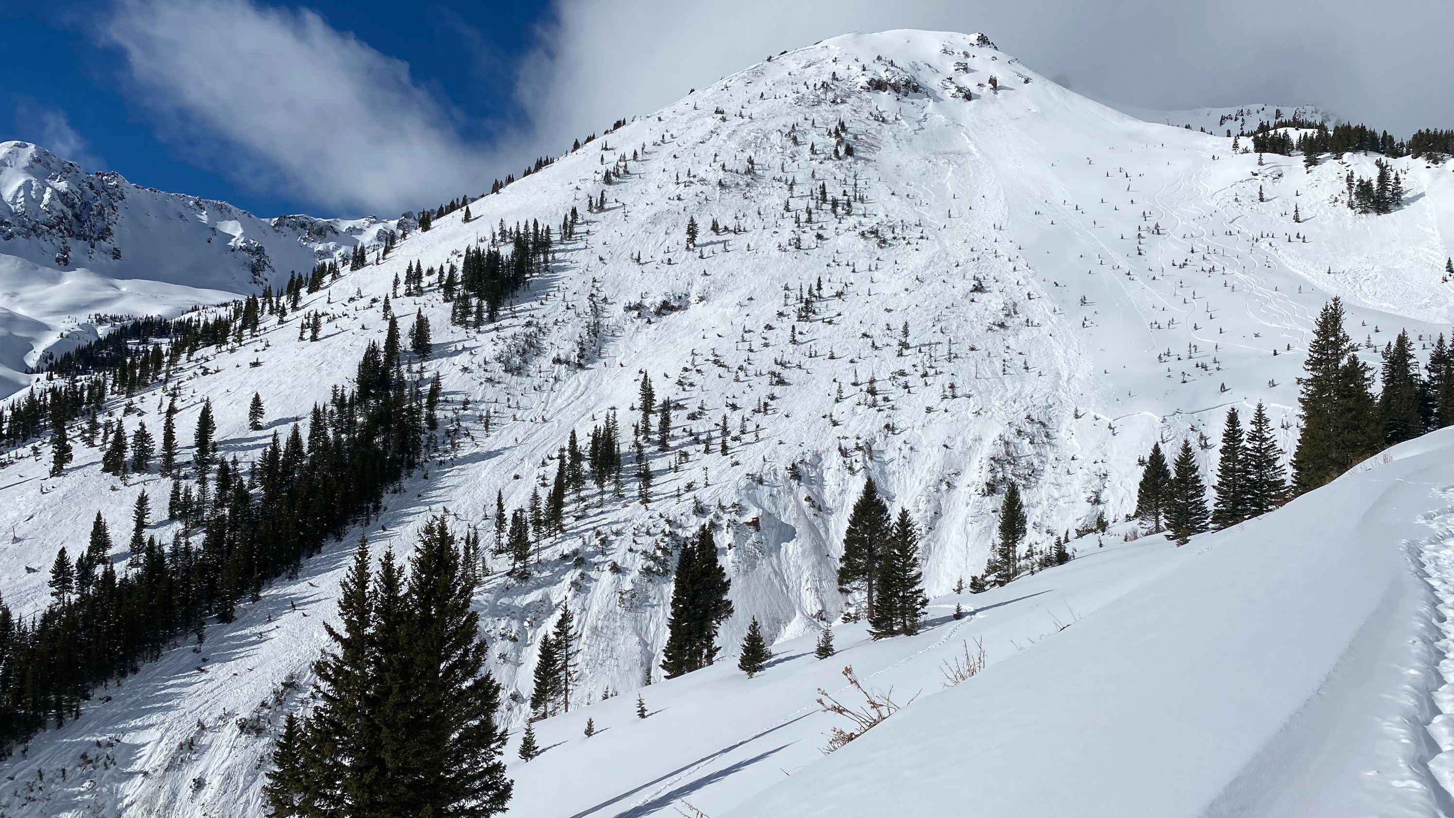 The group of skiers' tracks are still visible to the right of the avalanche, according to the Colorado Avalanche Information Center.