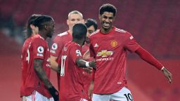 MANCHESTER, ENGLAND - FEBRUARY 02: Marcus Rashford of Manchester United celebrates with team mate Fred after their team's third goal, an own goal scored by Jan Bednarek of Southampton (not pictured) during the Premier League match between Manchester United and Southampton at Old Trafford on February 02, 2021 in Manchester, England. Sporting stadiums around the UK remain under strict restrictions due to the Coronavirus Pandemic as Government social distancing laws prohibit fans inside venues resulting in games being played behind closed doors. (Photo by Laurence Griffiths/Getty Images)