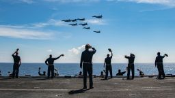 INDIAN OCEAN (Nov. 20, 2020) Master Chief David Conduff, command master chief of the aircraft carrier USS Nimitz (CVN 68), waves to four F-18's from the Nimitz and four MiG 29K Fulcrum K from the Indian navy aircraft carrier INS Vikramaditya (R 33) on the flight deck of the Nimitz while participating in Malabar 2020 in the Indian Ocean. Malabar 2020 is the latest in a continuing series of exercises that has grown in scope and complexity over the years to address the variety of shared threats to maritime security in the Indo-Pacific where the U.S. Navy has patrolled for more than 70 years promoting regional peace and security. The Nimitz Carrier Strike Group is currently deployed to the U.S. 7th Fleet area of operations in support of a free and open Indo-Pacific. (U.S. Navy photo by Mass Communication Specialist 3rd Class Charles DeParlier)
