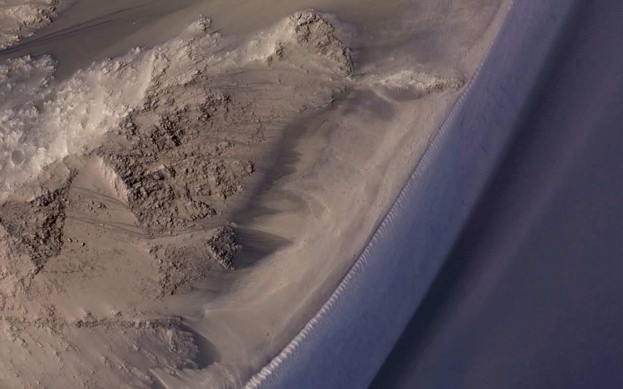 This image shows seasonal flows in Valles Marineris on Mars, which are called Recurring Slope Lineae, or RSL. These Martian landslides appear on slopes during the spring and summer.
