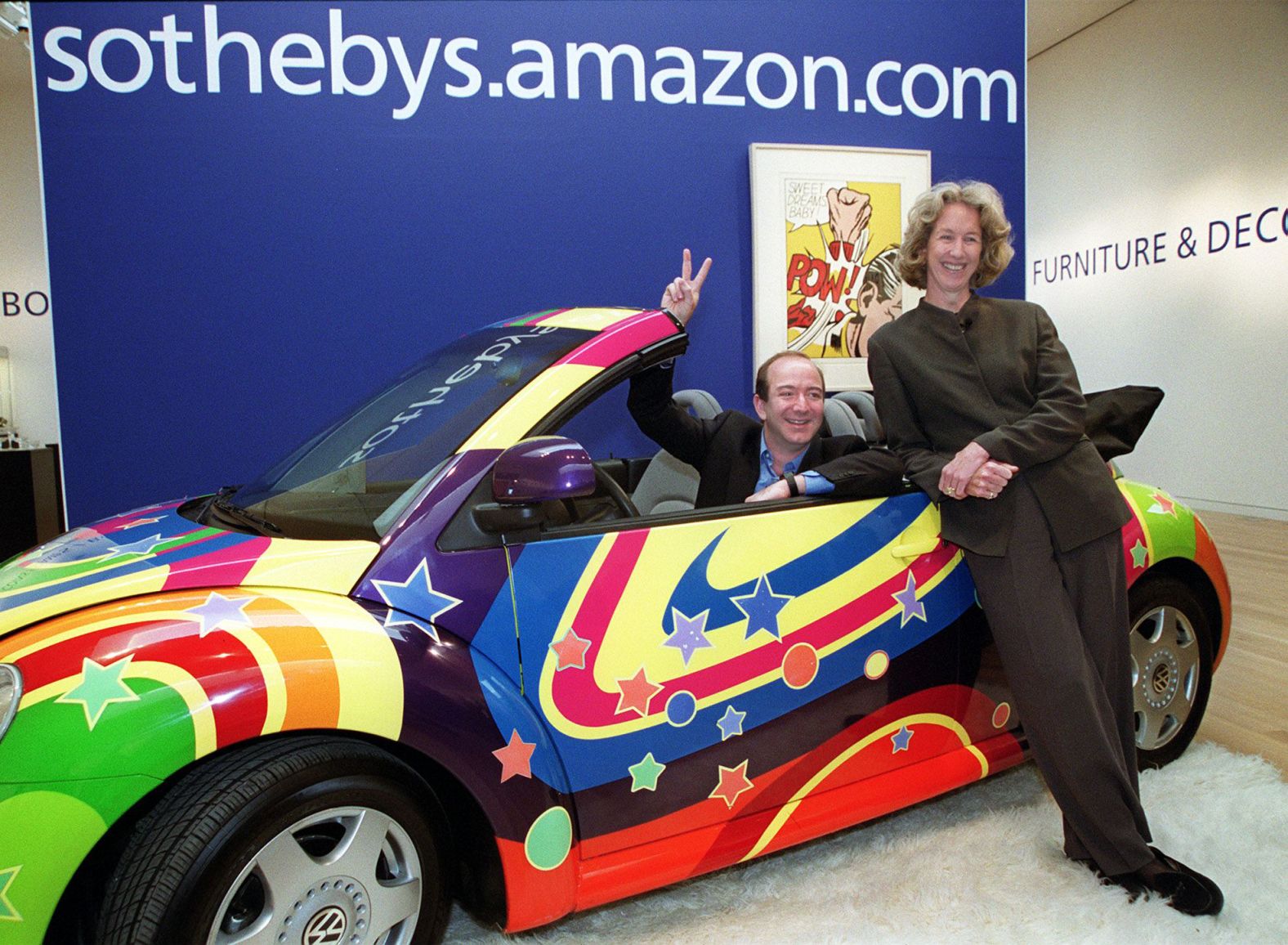 Bezos and Sotheby's president and CEO Diana Brooks pose in a customized Volkswagen Beetle from the film "Austin Powers: The Spy Who Shagged Me" in 1999. Sotheby's and Amazon had teamed up to launch sothebys.amazon.com, an online auction site that would offer a broad range of objects, including this car.