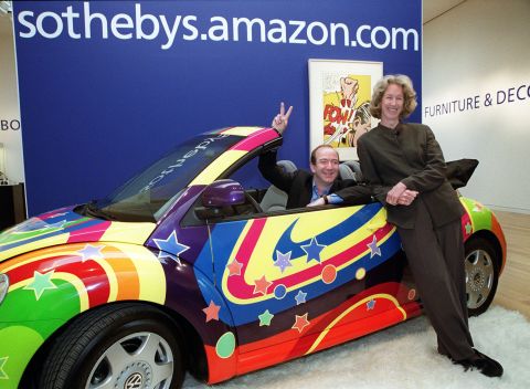 Bezos and Sotheby's president and CEO Diana Brooks pose in a customized Volkswagen Beetle from the film "Austin Powers: The Spy Who Shagged Me" in 1999. Sotheby's and Amazon had teamed up to launch sothebys.amazon.com, an online auction site that would offer a broad range of objects, including this car.