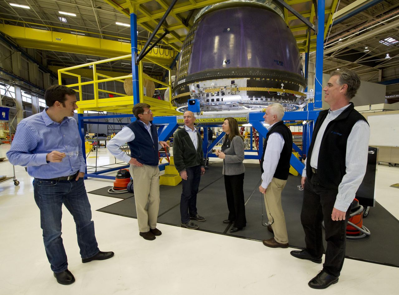 Bezos, third from left, meets with NASA Deputy Administrator Lori Garver at the Blue Origin headquarters in Kent, Washington, in 2011. Bezos' Blue Origin was started in 2000 with the goal of providing low-cost access to private space travel.