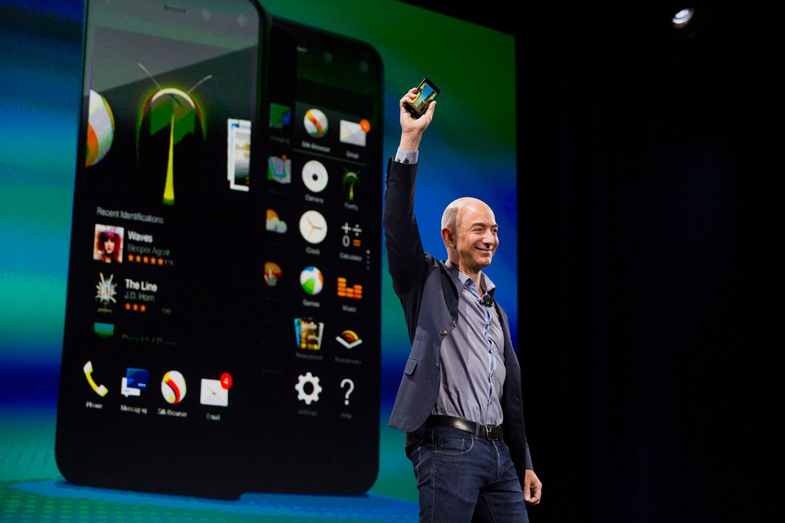 Bezos unveils the Fire Phone during an event in Seattle in 2014.