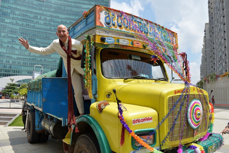 Bezos poses on a truck while visiting Bangalore, India, in 2014.