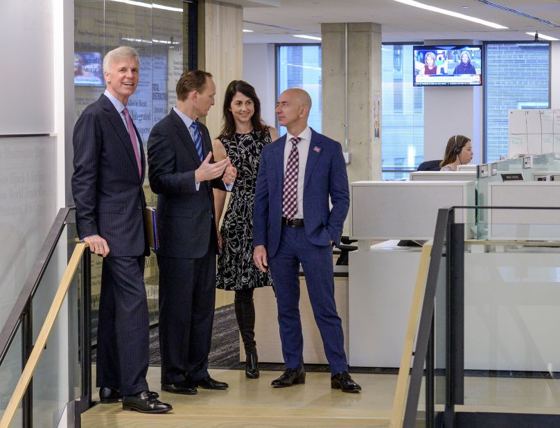 Bezos tours The Washington Post's new offices in 2016. Bezos bought the newspaper in 2013.