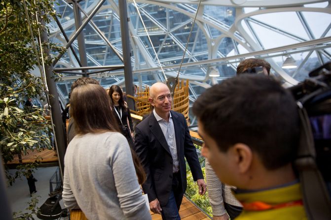 Bezos tours the Spheres, a gathering and working space for Amazon employees, at its opening ceremonies in Seattle in 2018. The space contains hundreds of plant species from cloud forest environments around the globe, and it maintains a tropical climate similar to Costa Rica or Indonesia. 