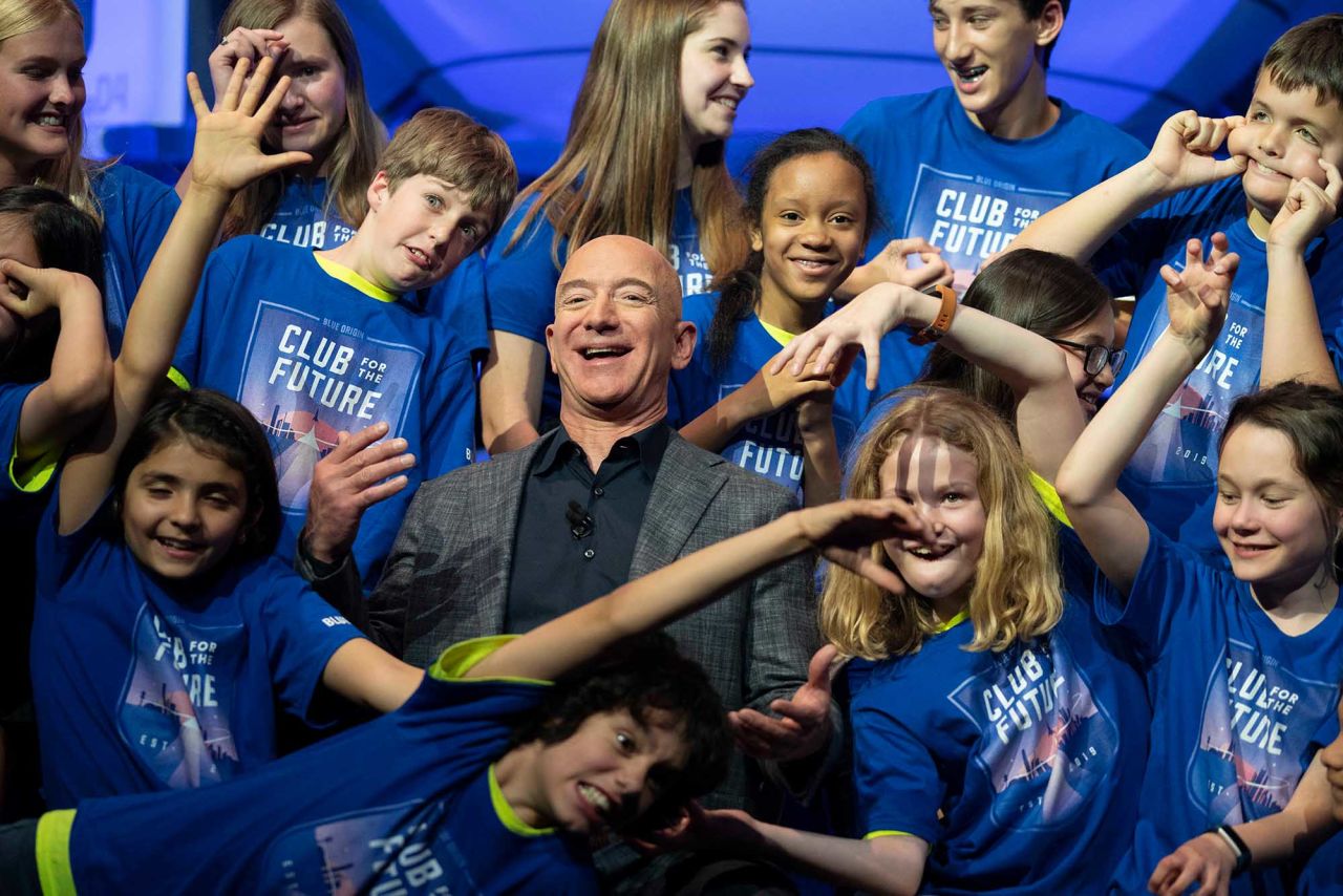 Bezos is joined by the children from the Blue Origin Club for the Future in 2019. At the event in Washington, DC, Bezos unveiled a Blue Origin prototype of a lunar lander.