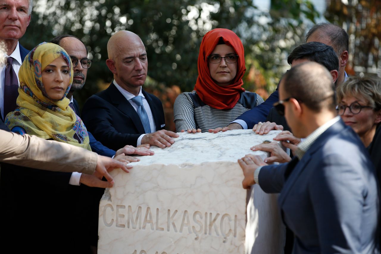 Bezos stands next to Hatice Cengiz, the fiancee of the late journalist Jamal Khashoggi, as a plaque is unveiled near the Saudi consulate in Istanbul in 2019. It was a year after Khashoggi, a Washington Post columnist, was killed.