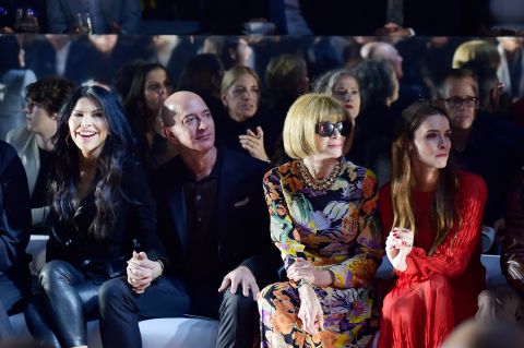 Bezos sits between his girlfriend, Lauren Sánchez, and Vogue magazine editor Anna Wintour at a Tom Ford fashion show in Los Angeles in February 2020.