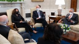 US President Joe Biden hosts a meeting alongside US Vice President Kamala Harris (L), with Senate Democrats, including Senate Majority Leader Chuck Schumer (R), and Senator Patrick Leahy (L), Democrat of Vermont, as they meet about a Covid relief bill in the Oval Office of the White House in Washington, DC, February 3, 2021.