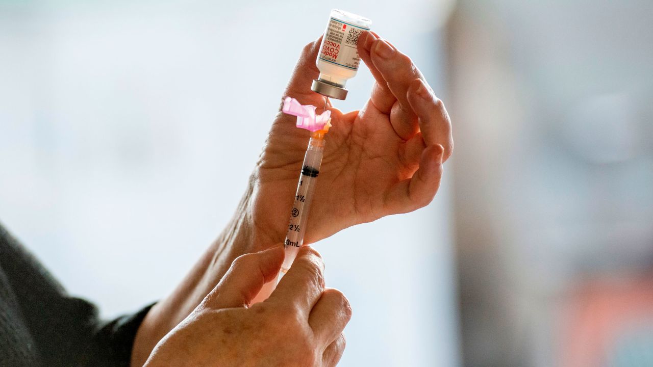 Administrative Director Elaine Boerger fills a syringe with the Moderna Covid-19 vaccine at the East Boston Neighborhood Health Center (EBNHC) in Boston, Massachusetts.