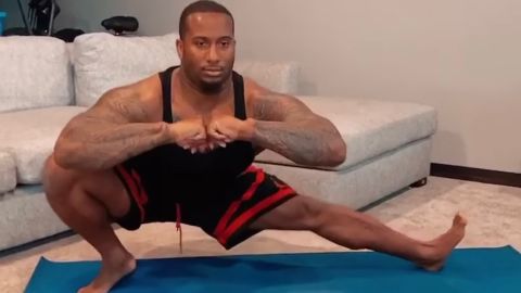 Mike Daniels performs deep lateral lunges, which improve hip mobility. He practices yoga twice a week.