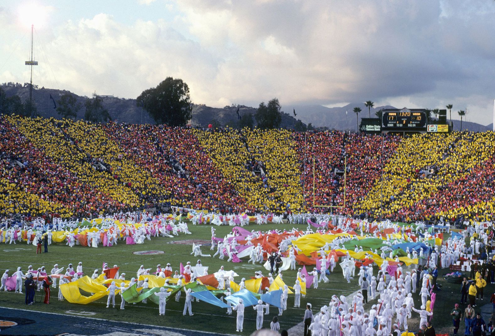 The crowd contributes a colorful background to the Super Bowl halftime show in 1983, which was held at the Rose Bowl in Pasadena, California.