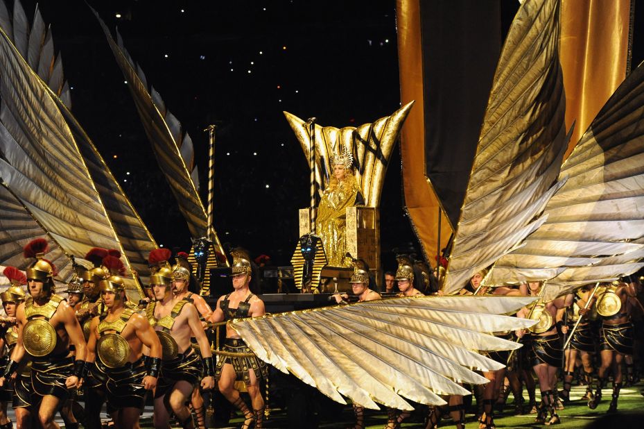 Madonna, clad as a Roman goddess, is carried to the stage in 2012.