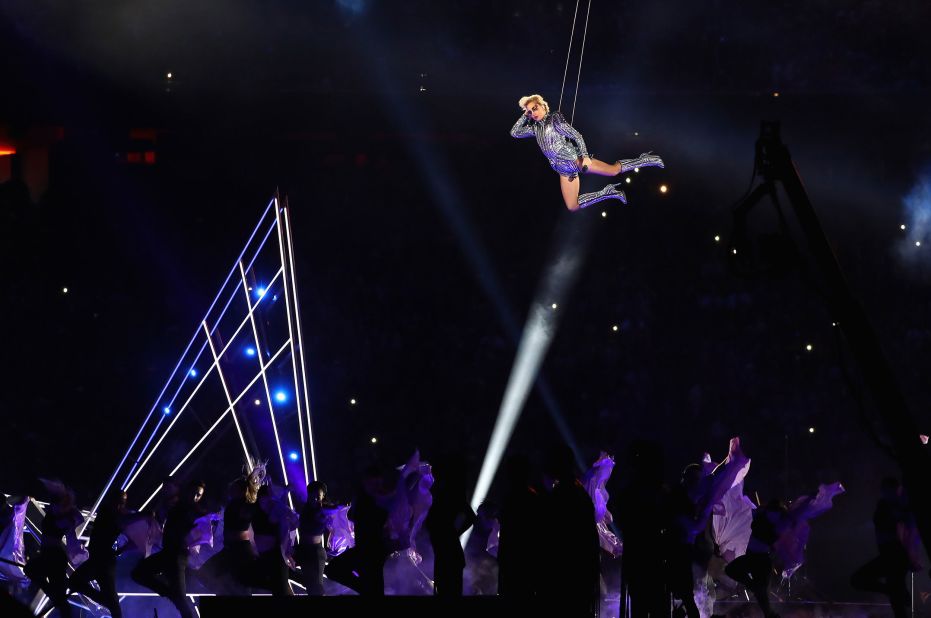 Lady Gaga is suspended in the air while performing in Houston in 2017.