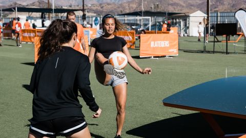 Competitors participating in a women's Teqball tournament.