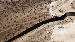 An aerial view of a U.S. Border Patrol vehicle positioned next to the U.S.-Mexico border barrier on June 28, 2019 in Sunland Park, New Mexico. 