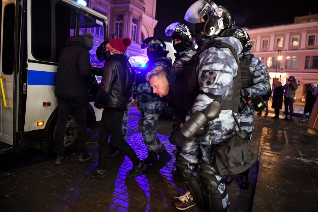 Riot police detain a protester after a court decision to imprison Alexey Navalny, in downtown Moscow in the early hours of Wednesday.
