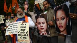 Activists of United Hindu Front (UHF) hold placards and pictures of Swedish climate activist Greta Thunberg and Barbadian singer Rihanna during a demonstration in New Delhi on February 4, 2021, after they made comments on social media about ongoing mass farmers' protests in India.