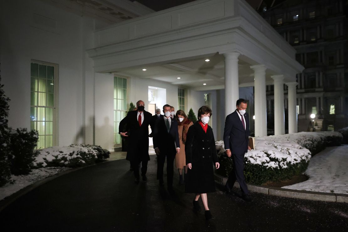 GOP Sens. Susan Collins and Mitt Romney lead a group of 10 fellow Republican senators out of the West Wing after meeting with President Joe Biden and Vice President Kamala Harris at the White House earlier this month. 
