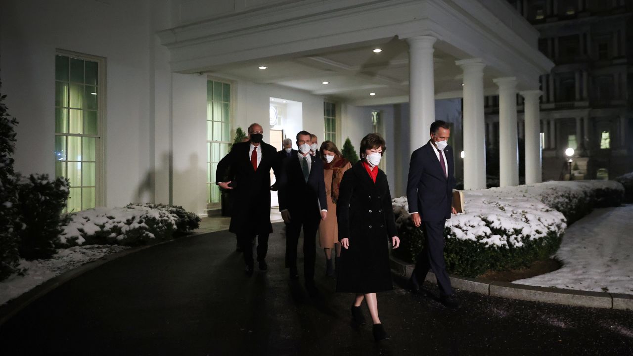 GOP Sens. Susan Collins and Mitt Romney lead a group of 10 fellow Republican senators out of the West Wing after meeting with President Joe Biden and Vice President Kamala Harris at the White House earlier this month. 