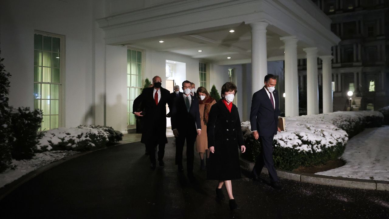 GOP Sens. Susan Collins and Mitt Romney lead a group of 10 fellow Republican senators out of the West Wing after meeting with President Joe Biden and Vice President Kamala Harris at the White House earlier this month.