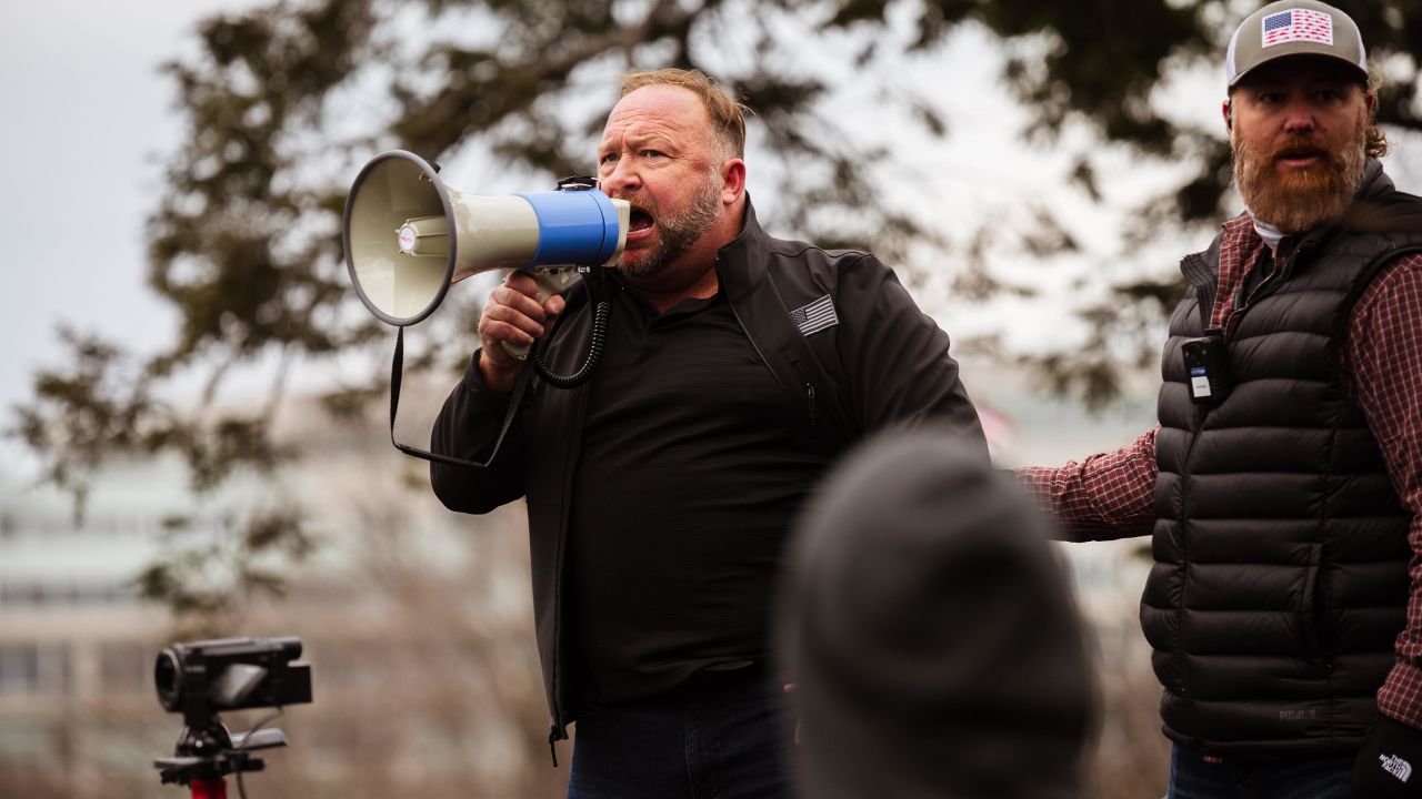 Alex Jones, the founder of right-wing media group Infowars, addresses a crowd of pro-Trump protesters after they storm the grounds of the Capitol Building on January 6, 2021 in Washington, DC.
