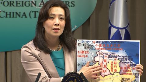 Taiwan's Ministry of Foreign Affairs spokesperson Joanne Ou points at a map of Guyana on February 4, 2021.